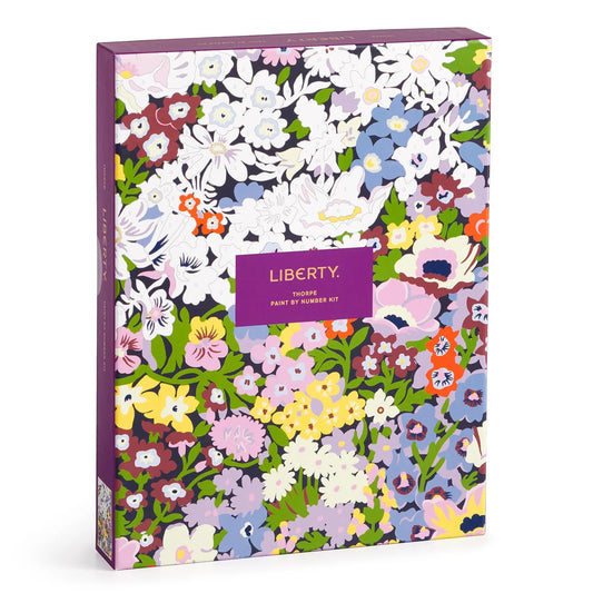 Patchwork with Busyfingers Liberty Thorpe Paint by Number Kit featuring a vibrant floral pattern with pink, yellow, blue, and white flowers on a dark background.
