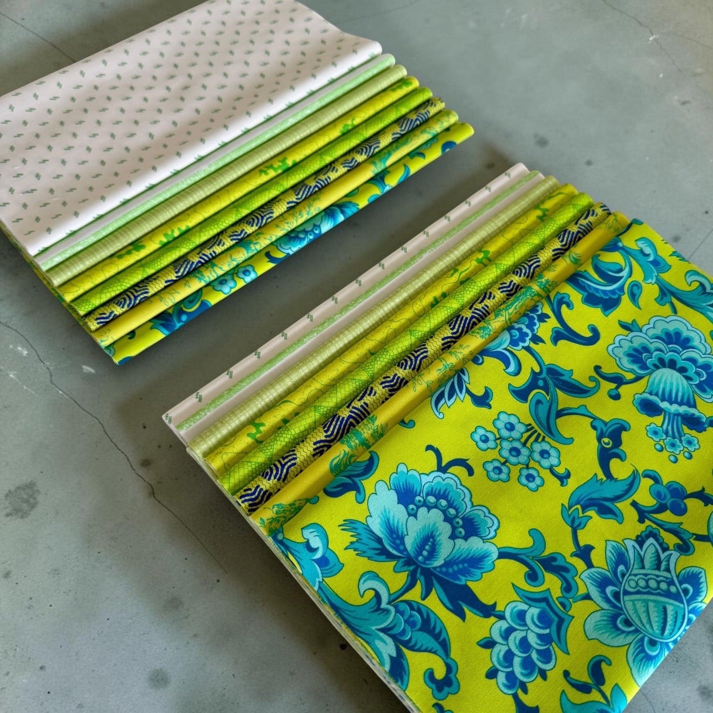 Patchwork with Busyfingers Lime Sorbet fabric fat eighth pack featuring 8 assorted green and blue cotton quilt prints.