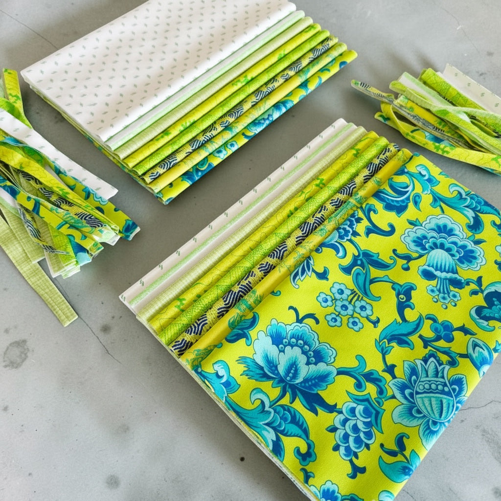 Patchwork with Busyfingers Lime Sorbet 8-piece cotton fabric fat eighth pack featuring assorted green and blue prints.