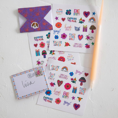 Patchwork with Busyfingers Little Envelope Letters stationery set with colorful stickers and a folded purple envelope with a dog sticker.
