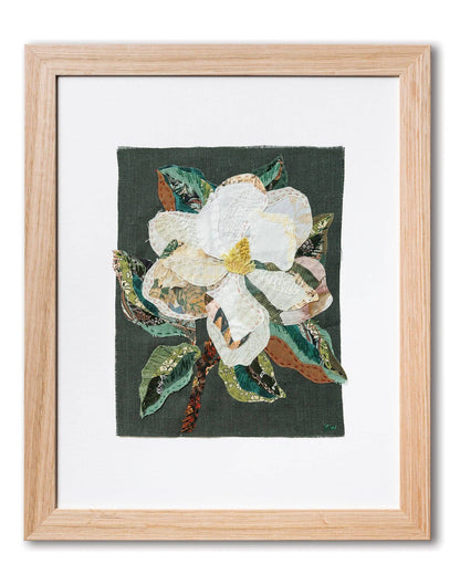 Patchwork with Busyfingers Magnolia slow-stitching fabric art featuring white petals and green leaves in a wood frame.