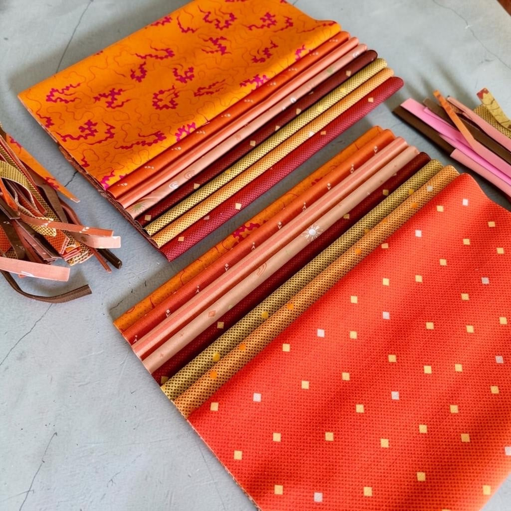 Patchwork with Busyfingers Marigold Spice fat eighth fabric pack featuring 8 assorted cotton prints in warm tones.