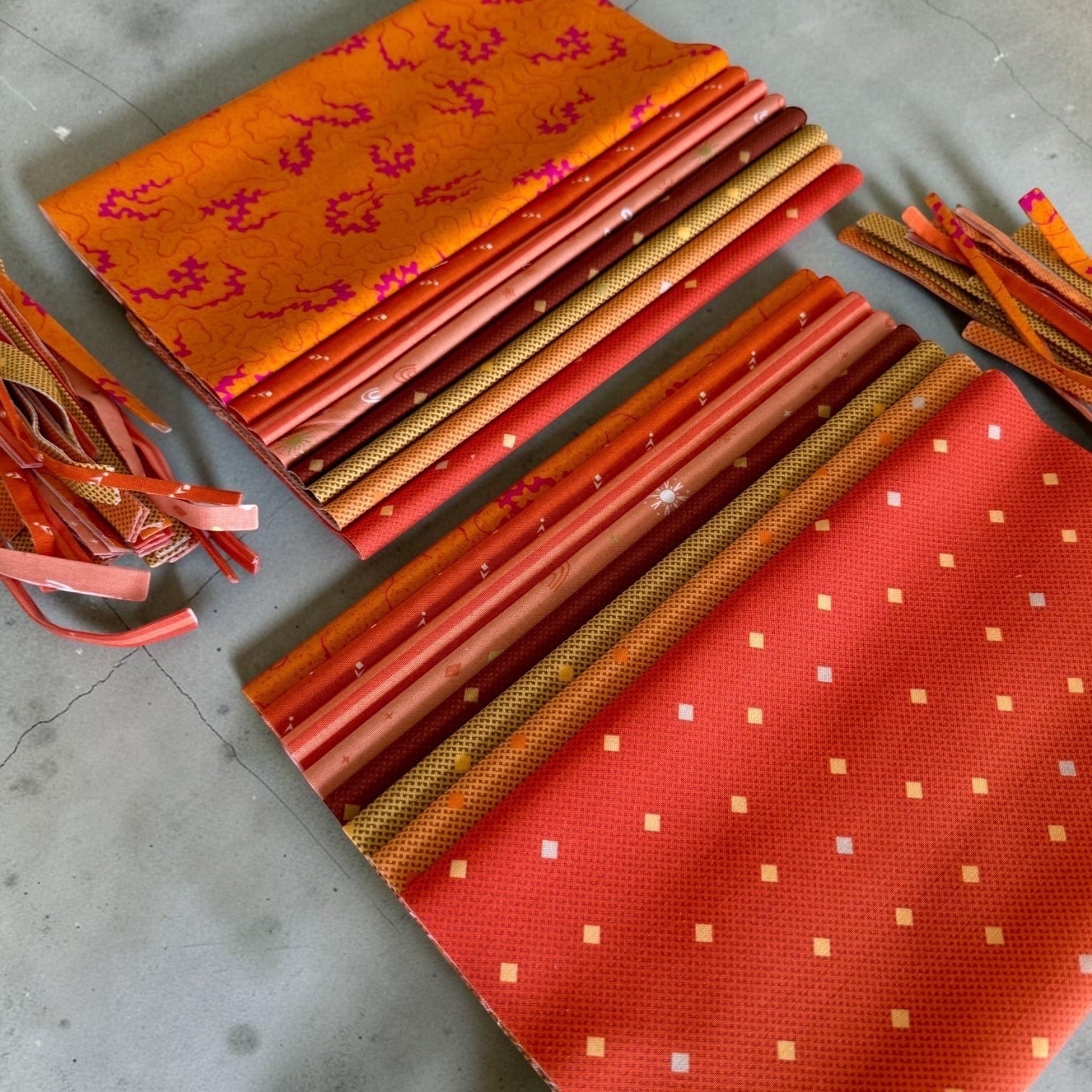 Patchwork with Busyfingers Marigold Spice 8-piece cotton fabric fat eighth pack featuring assorted orange prints.