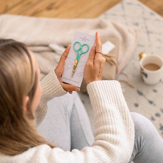 Patchwork with Busyfingers mint coloured embroidery scissors with gold finish blades and pointed tips for precise cutting.