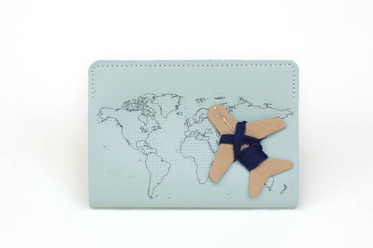 Patchwork with Busyfingers mint leather passport cover with debossed world map and airplane embroidery kit.