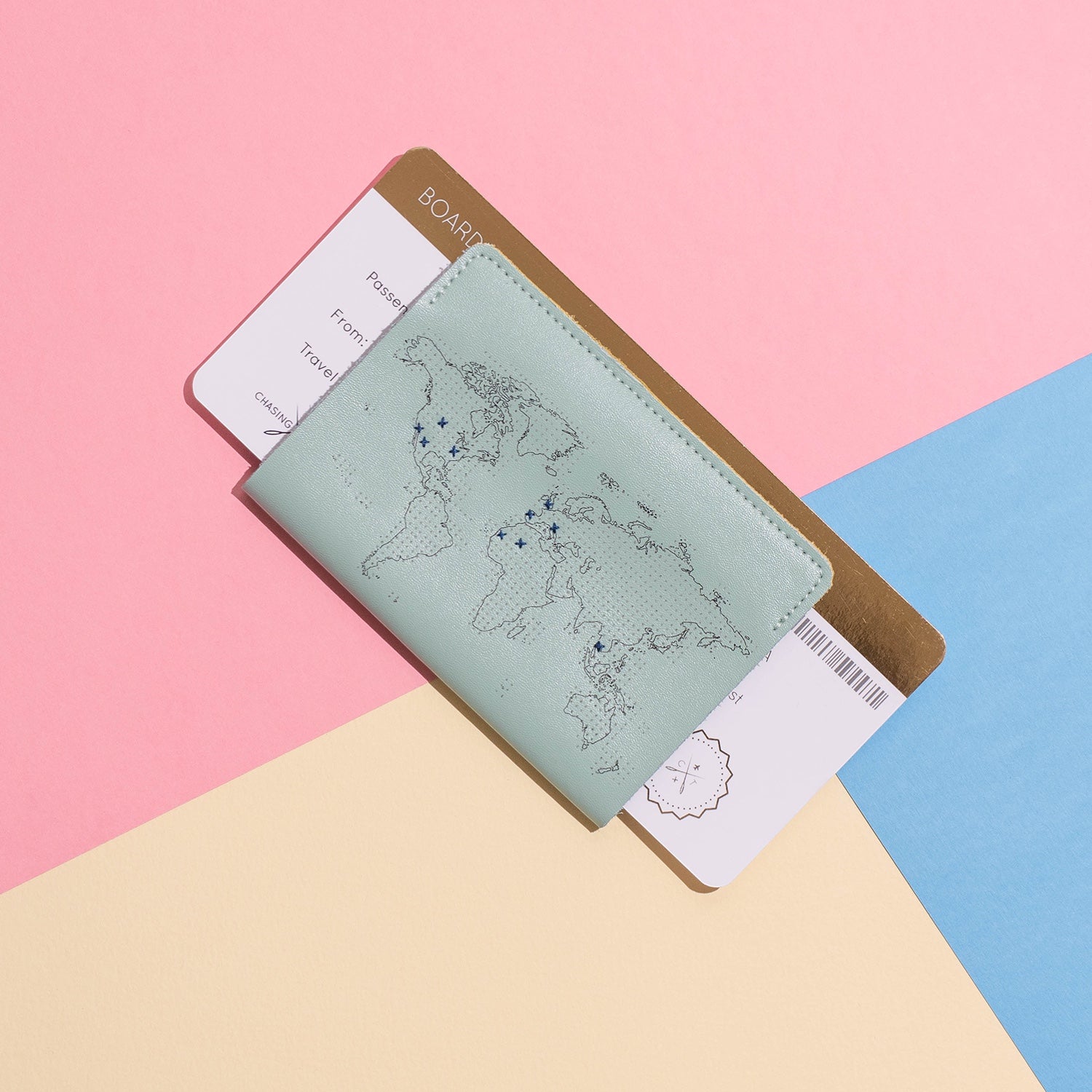 Patchwork with Busyfingers mint leather passport cover with debossed world map and embroidery marks. Includes passport and boarding pass.