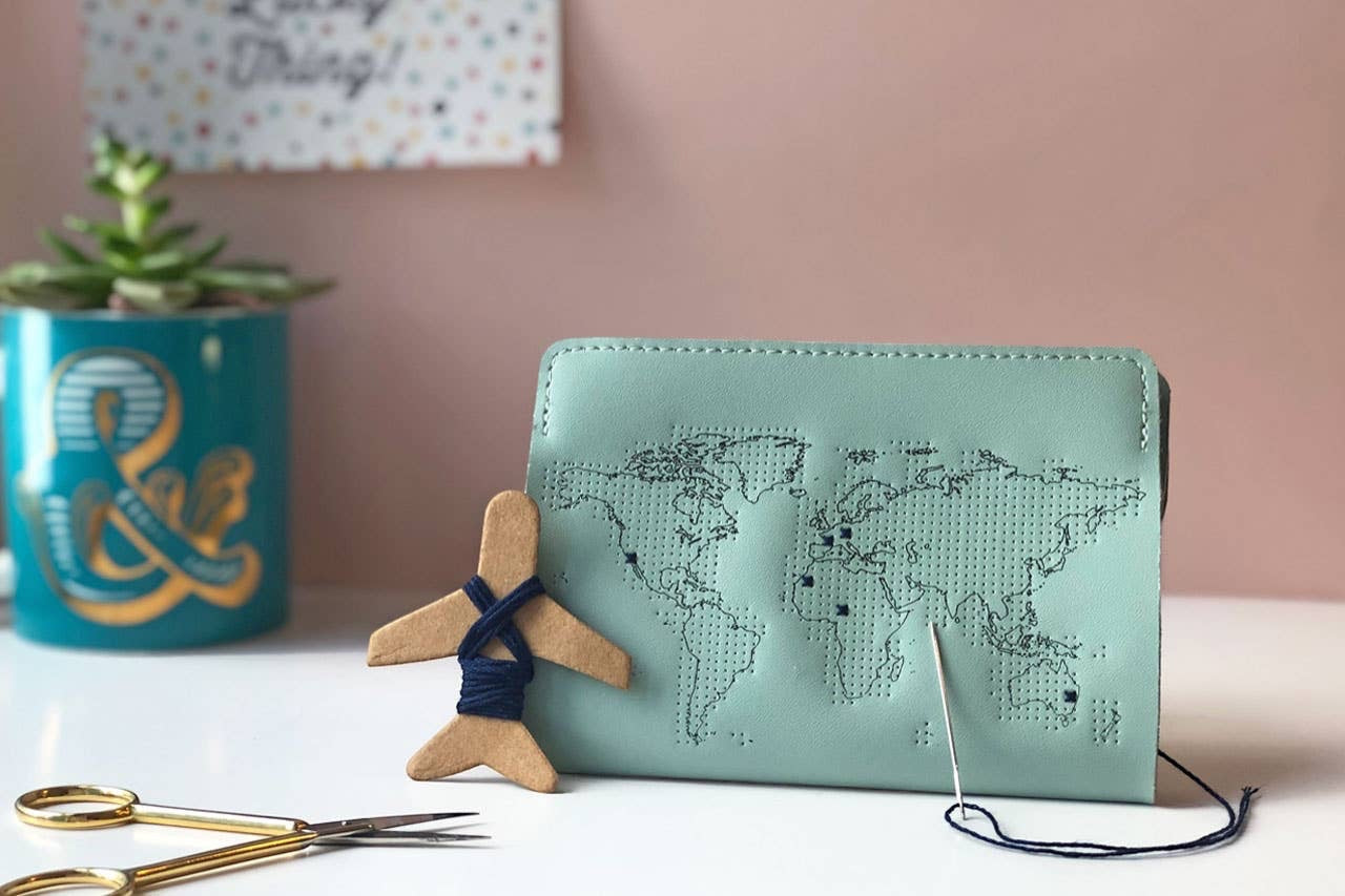 Patchwork with Busyfingers mint leather passport cover kit with debossed world map for embroidery. Includes needle and thread.