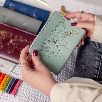Patchwork with Busyfingers mint leather passport cover kit with debossed world map, embroidered with colourful travel markers.