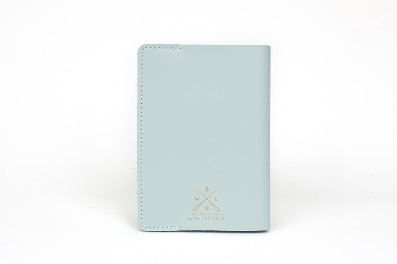 Patchwork with Busyfingers mint green leather passport cover with debossed world map and stitching detail.