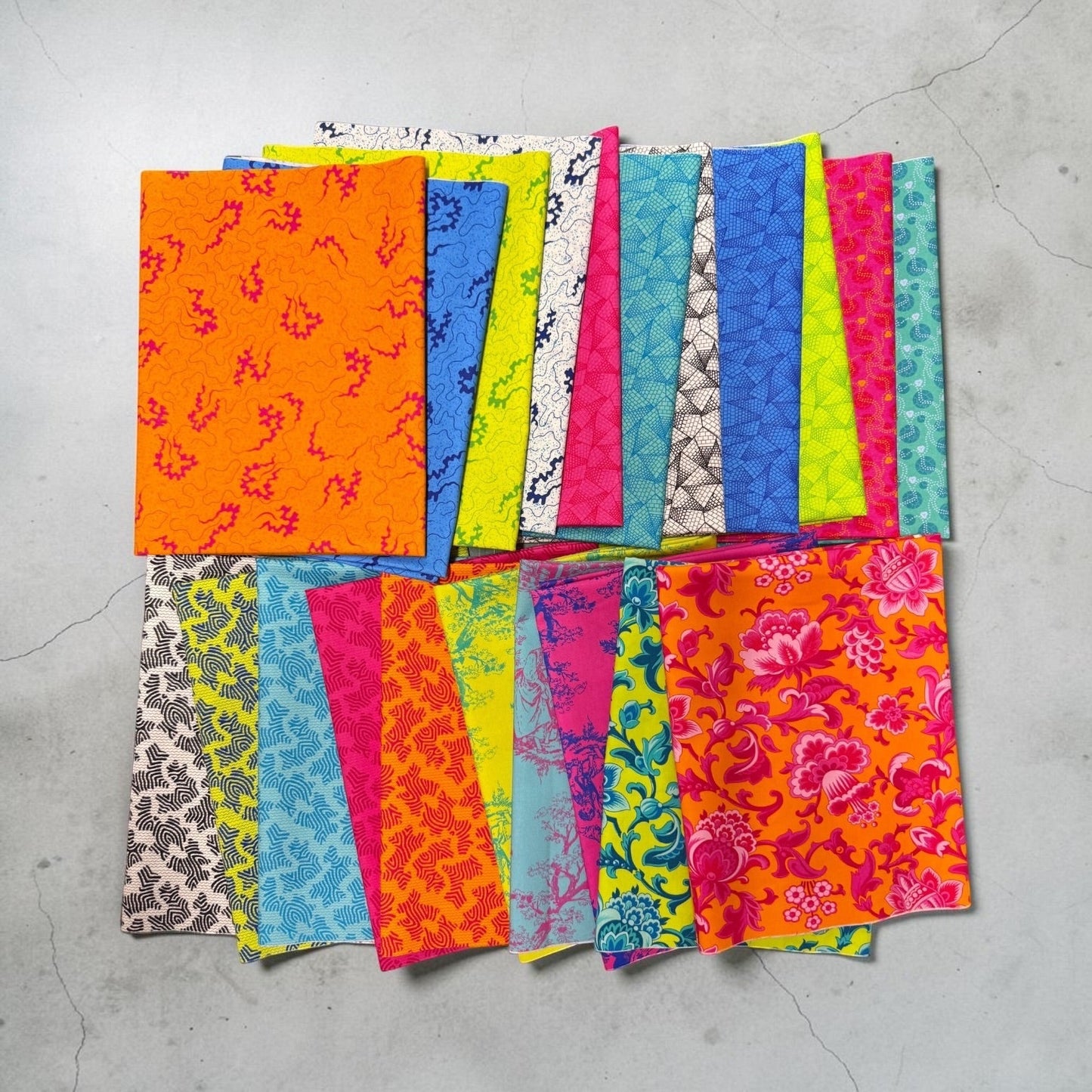 Patchwork with Busyfingers Miscellany 21pc premium cotton fabric bundle with vibrant floral and geometric patterns.