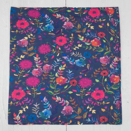 Patchwork with Busyfingers navy bandeau with a vibrant wildflower print in pink, blue, and orange. Soft, stretchy fabric.