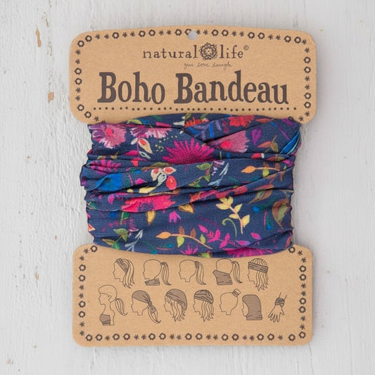 Patchwork with Busyfingers navy blue bandeau with a vibrant floral print in pink, purple, and yellow. Versatile accessory for hair or wrist.