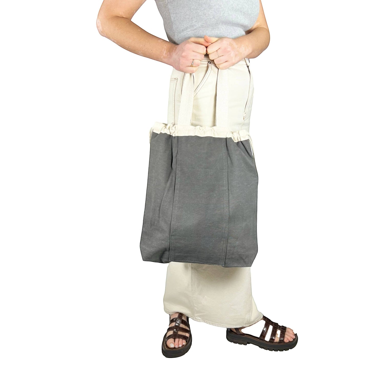 Patchwork with Busyfingers olive washed canvas backpack with drawstring closure and dual shoulder straps.