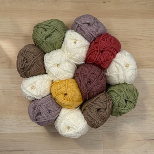Patchwork with Busyfingers Poinsettia Garden Wool Yarn Set, featuring 28 balls of 8ply Australian Merino wool in red, green, white, brown, purple, and yellow.