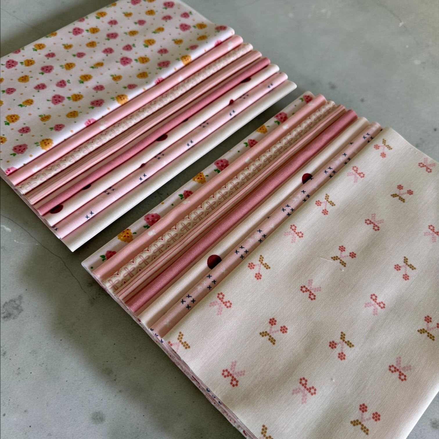 Patchwork with Busyfingers Powder Puff fat eighth fabric pack featuring 8 assorted pink and cream floral cotton prints.
