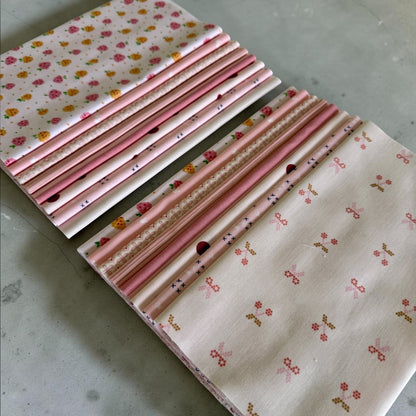 Patchwork with Busyfingers Powder Puff fat eighth fabric pack featuring 8 assorted pink and cream floral cotton prints.