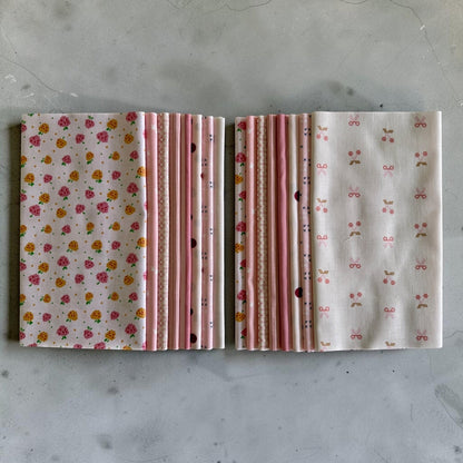 Patchwork with Busyfingers Powder Puff fat eighth fabric pack featuring 8 assorted pink and cream cotton prints.