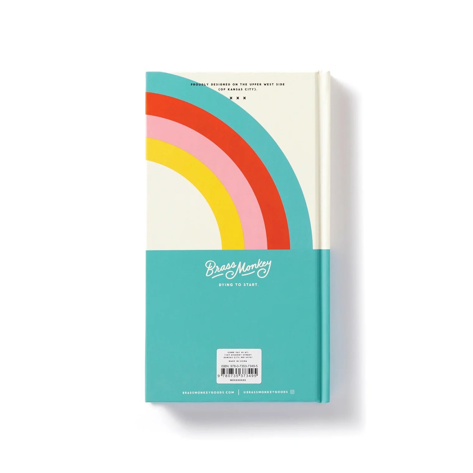Patchwork with Busyfingers journal with a cream cover featuring a colorful rainbow arc and teal bottom. "Brass Monkey Dying to Start" logo.