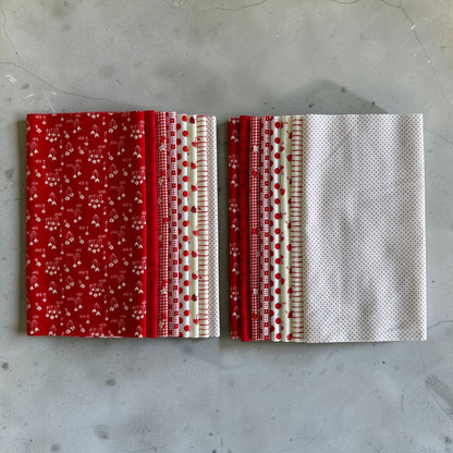 Patchwork with Busyfingers Strawberries & Cream fat eighth fabric pack featuring 8 assorted red and white cotton prints.