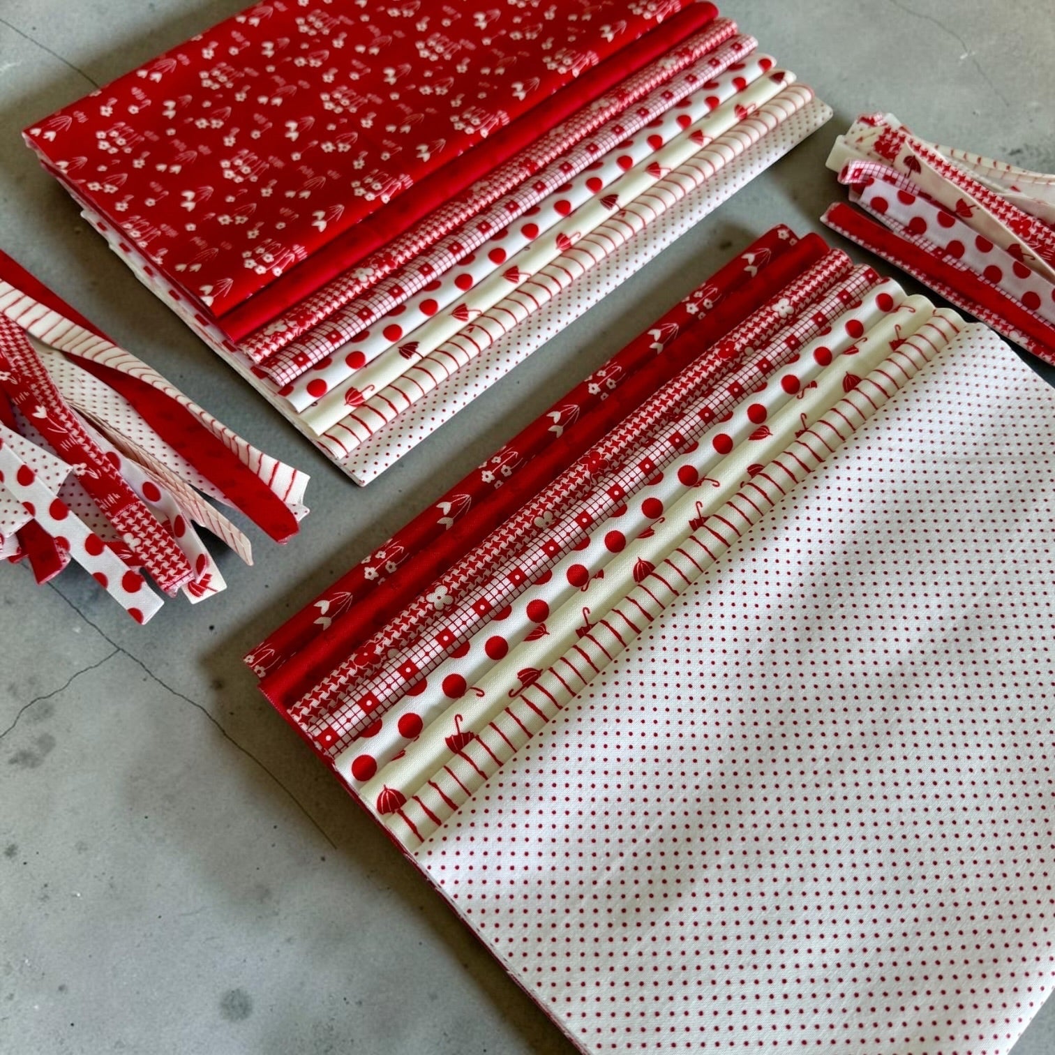 Patchwork with Busyfingers Strawberries & Cream cotton fabric fat eighth pack with 8 assorted red and white prints.
