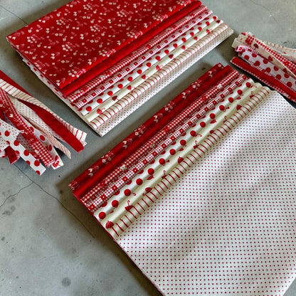 Patchwork with Busyfingers Strawberries & Cream cotton fabric fat eighth pack with 8 assorted red and white prints.