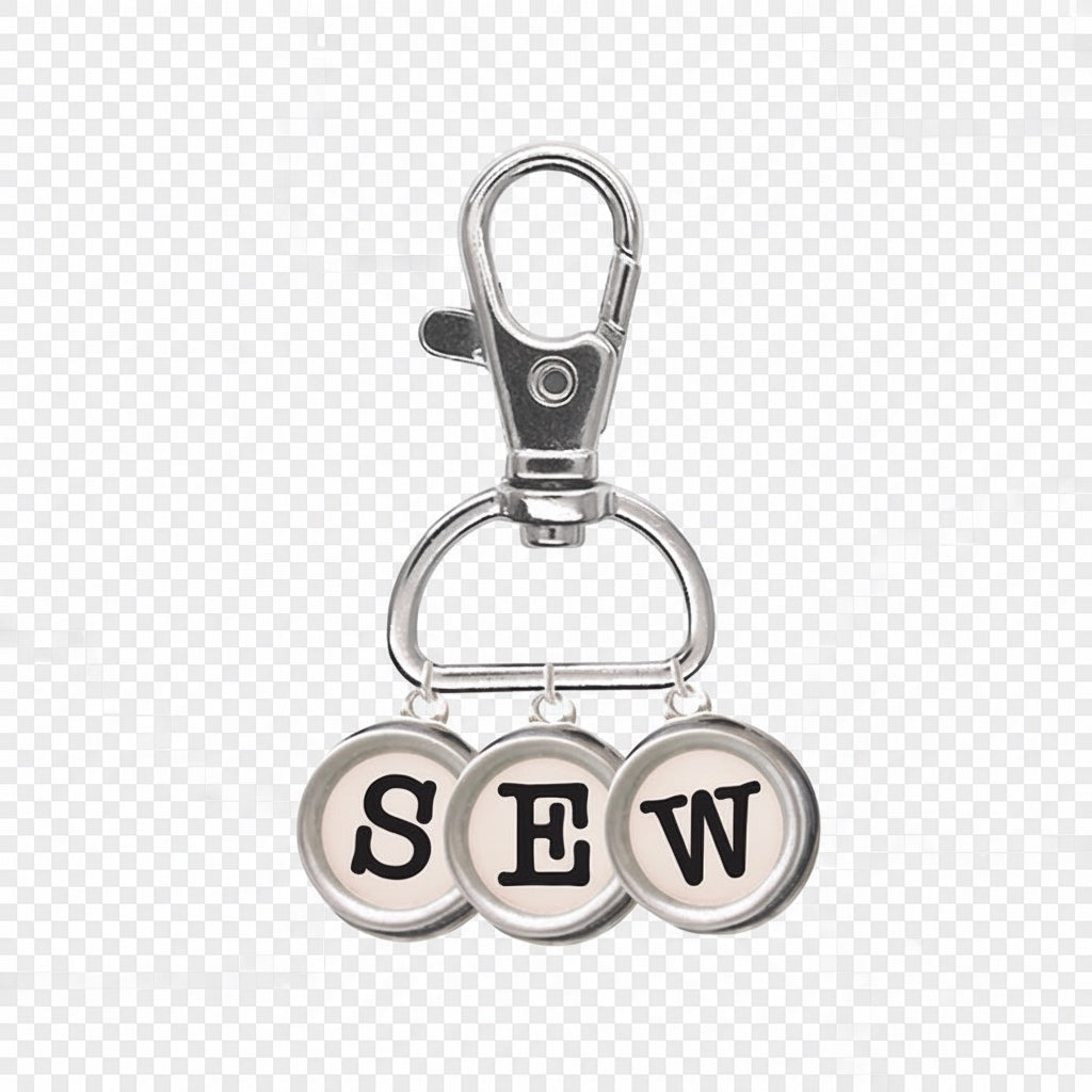 Patchwork with Busyfingers enamel charm typewriter keys spelling SEW with a silver lobster clasp.