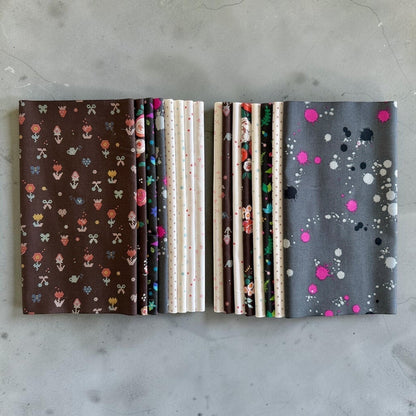 Patchwork with Busyfingers Slate & Granite fat eighth cotton fabric pack featuring 8 assorted floral and splatter prints