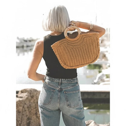 Patchwork with Busyfingers Summer Crochet book inspiration featuring a woman carrying a tan straw bag with wooden handles