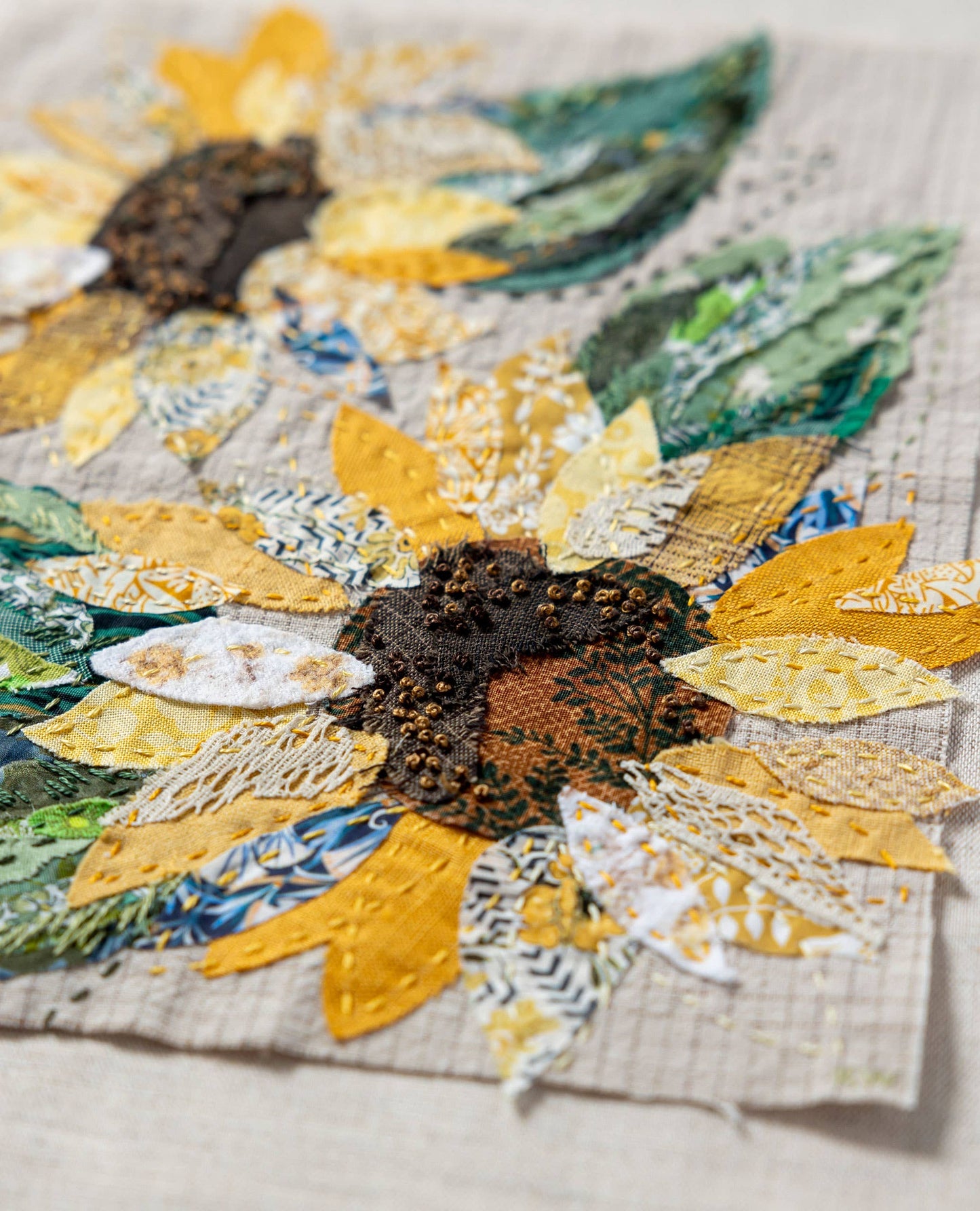 Patchwork with Busyfingers Sun Flower Slow Stitching Kit featuring textured cotton, linen, and Liberty floral fabrics.