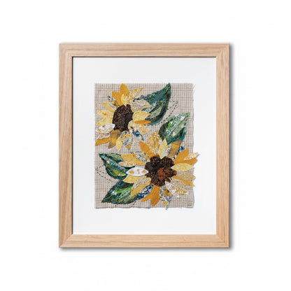 Patchwork with Busyfingers Sun Flower slow stitching kit featuring fabric sunflower collage in a light wood frame.