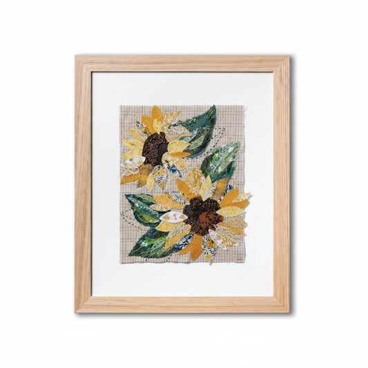 Patchwork with Busyfingers Sun Flower slow stitching kit featuring fabric sunflower collage in a light wood frame.