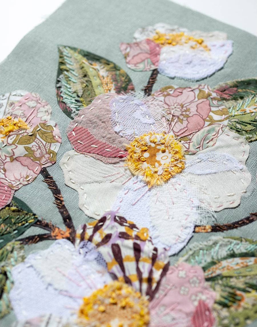 Patchwork with Busyfingers Sweet Grace slow stitching kit featuring floral applique on duck egg blue linen background