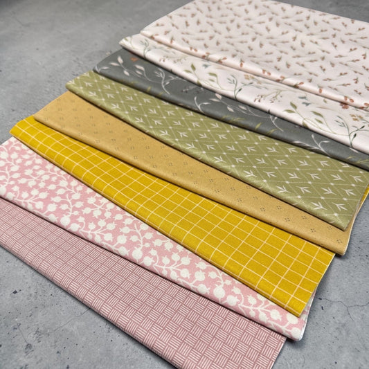 Threads of Grace 8pc cotton fabric bundle by Patchwork with Busyfingers featuring floral, grid, and geometric prints.