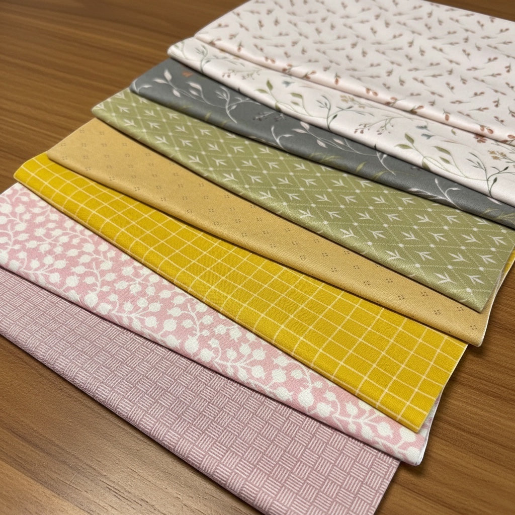 Patchwork with Busyfingers Threads of Grace 8pc cotton fabric bundle in soft floral, grid, and geometric patterns.