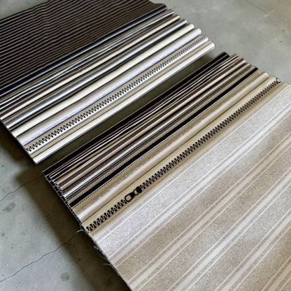 Patchwork with Busyfingers 8-piece cotton fabric fat eighth pack featuring assorted tonal stripe and zipper prints.