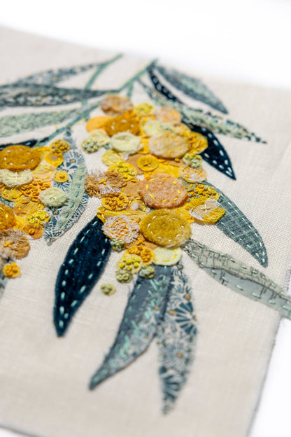 Patchwork with Busyfingers Wattle Glow slow stitching kit featuring textured yellow floral applique on linen fabric