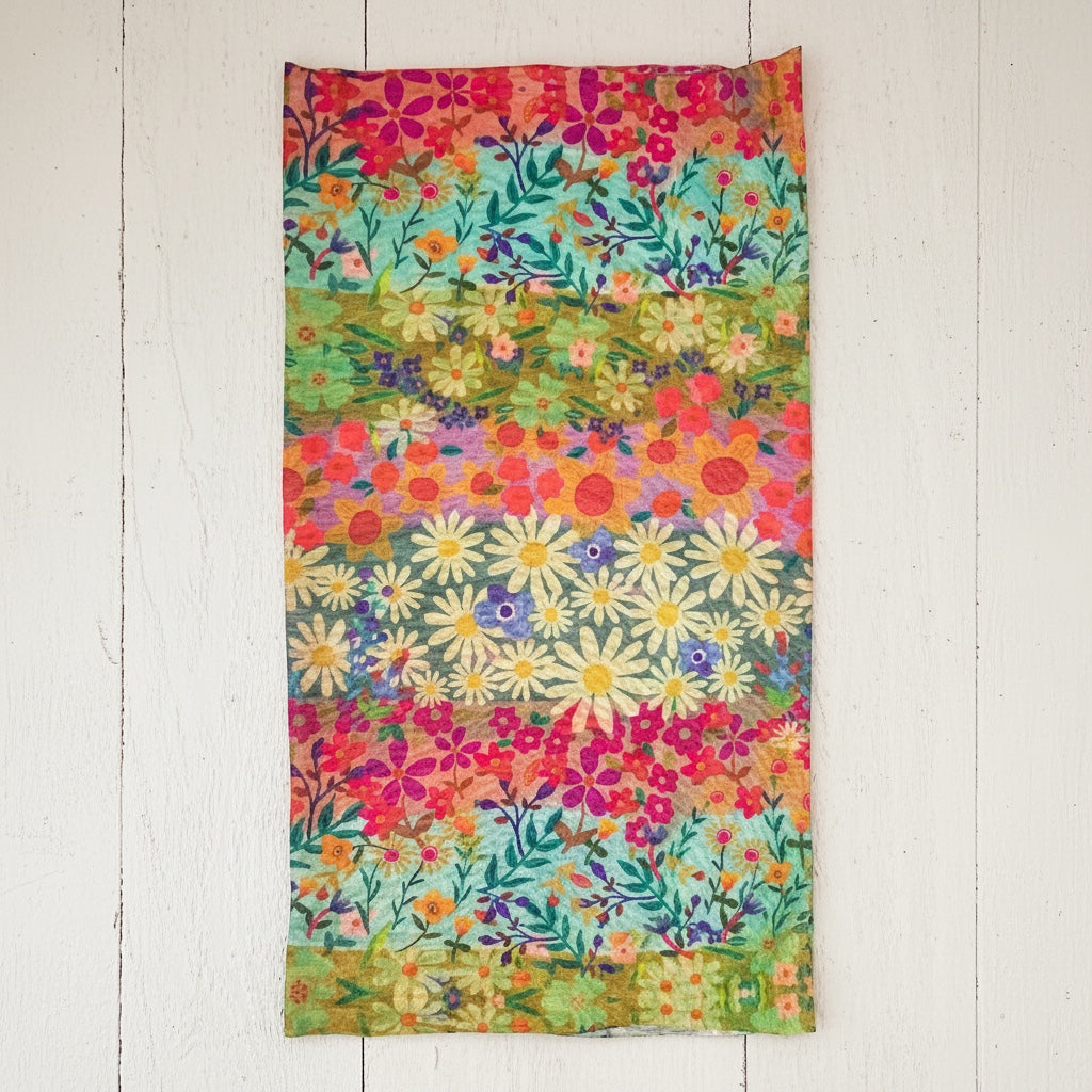 Patchwork with Busyfingers boho bandeau with a vibrant wildflower border print in pink, orange, yellow, green, and blue. Soft, stretchy fabric.
