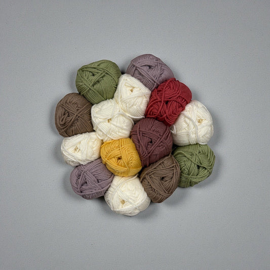 Patchwork with Busyfingers yarn set for The Hidden Stitch Blanket CAL Subscription. Includes balls of yarn in cream, olive green, burgundy, mustard yellow, and taupe.