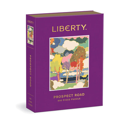 Patchwork with Busyfingers Liberty Prospect Road 500 piece puzzle in a purple book-shaped box with a colourful floral landscape.