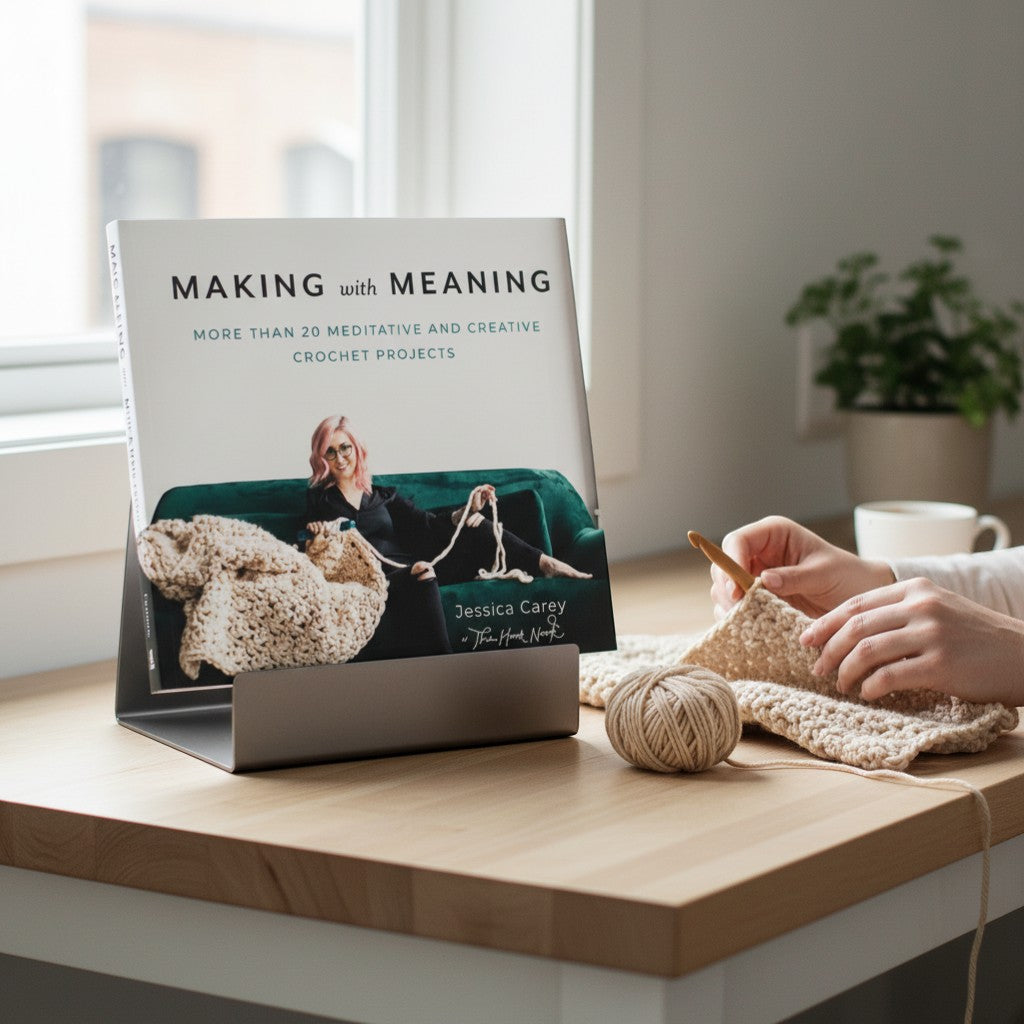 Patchwork with Busyfingers Making with Meaning book cover featuring Jessica Carey crocheting a large blanket. Paperback, 160 pages.