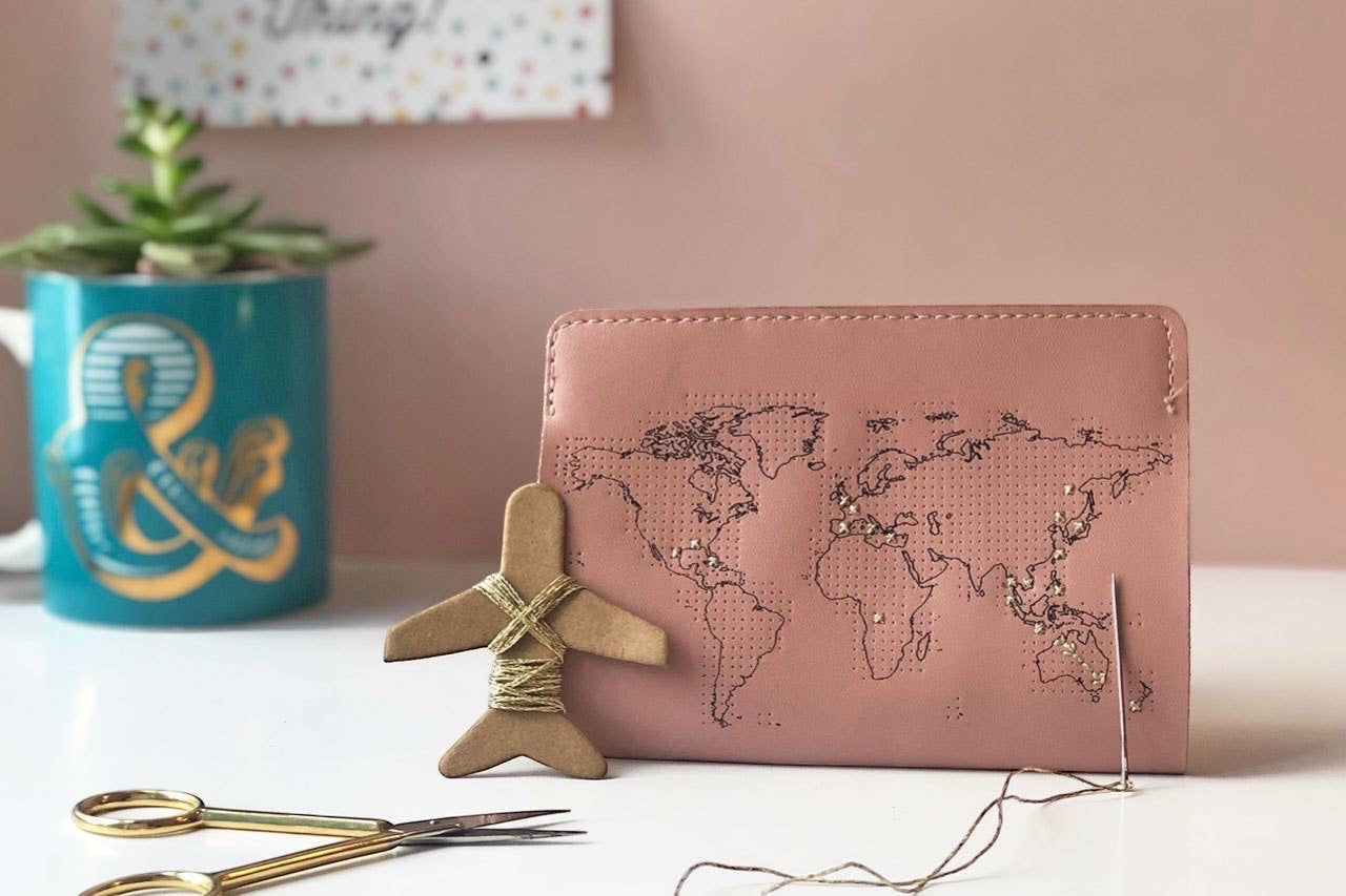 Patchwork with Busyfingers dusty pink leather passport cover with world map design, perforated for stitching visited countries.