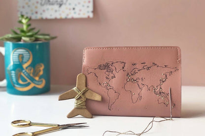 Patchwork with Busyfingers dusty pink leather passport cover with world map design, perforated for stitching visited countries.