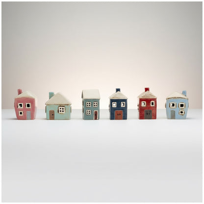 Patchwork with Busyfingers Grand Village Estate ceramic houses set in pink, blue, grey, and red. Hand-finished artisanal village decor.